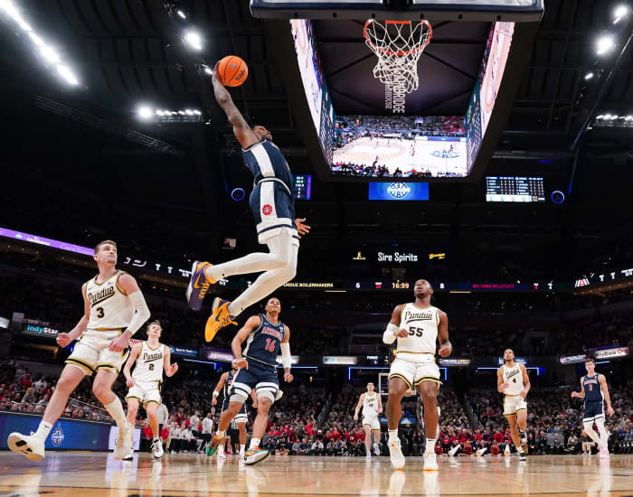 Arizona Wildcats guard Caleb Love goes up for a dunk against the Purdue Boilermakers.